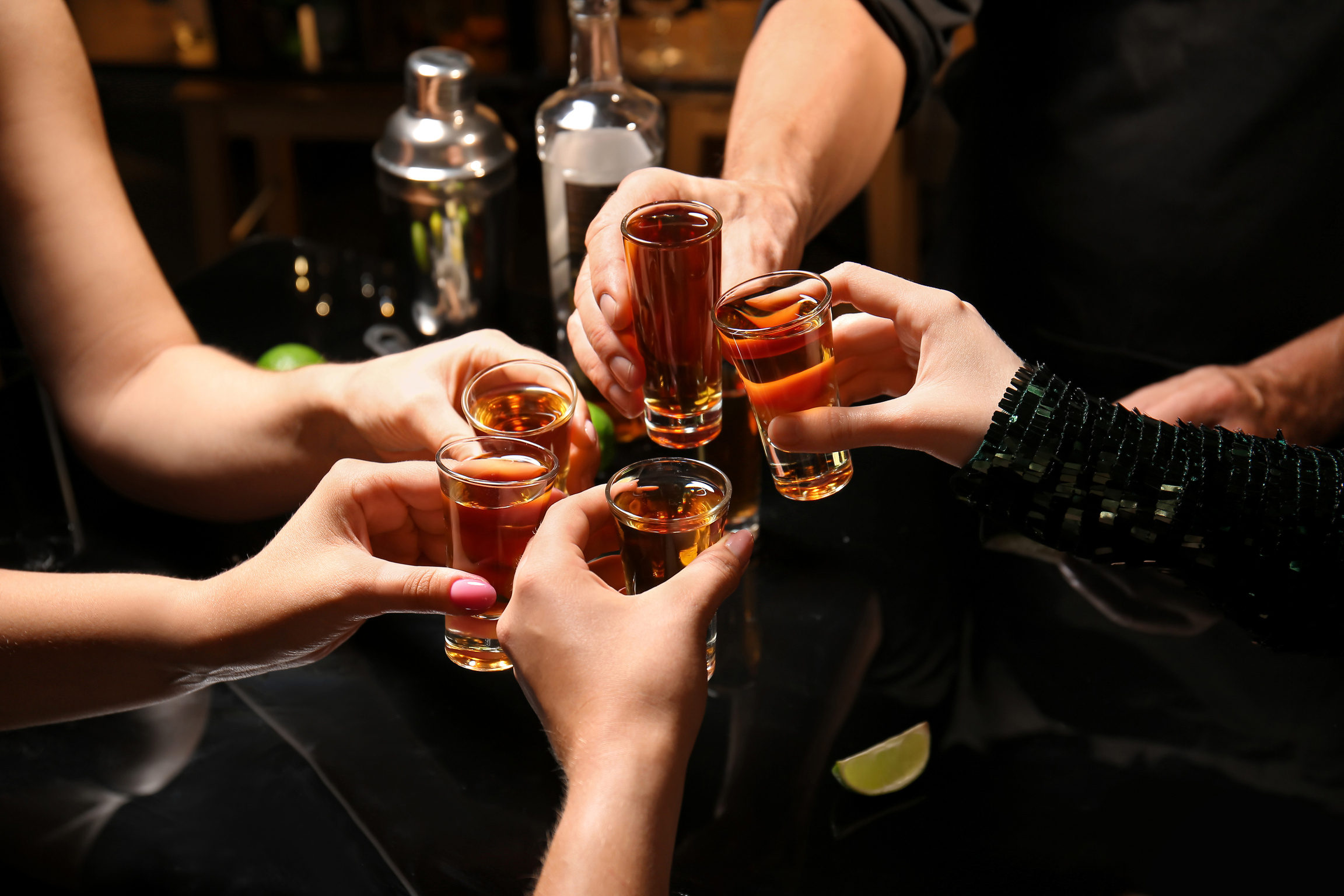 Friends with Shots of Tasty Tequila in Bar